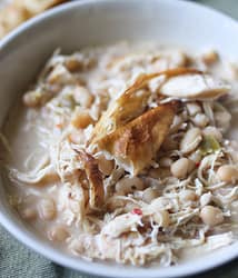 WHITE CHICKEN CHILI SERVED WITH CORNBREAD AND TORTILLA STRIPS